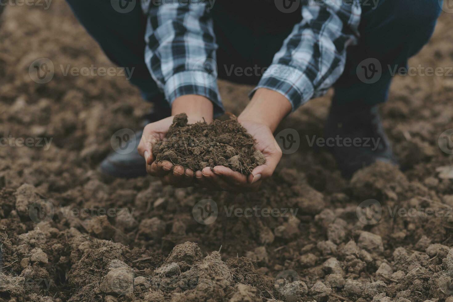 Symbol heart earth day. Handful of dirt hands heart shape. Farm organic earth. Farmer hands soil ground earth dirt garden soil farm ground. Male hands full of fertile land field agriculture concept photo