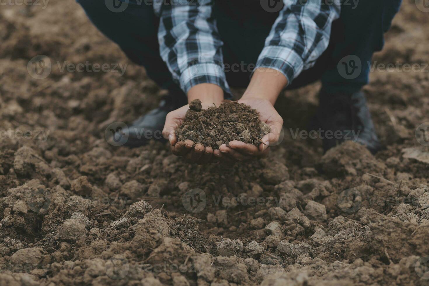 Symbol heart earth day. Handful of dirt hands heart shape. Farm organic earth. Farmer hands soil ground earth dirt garden soil farm ground. Male hands full of fertile land field agriculture concept photo