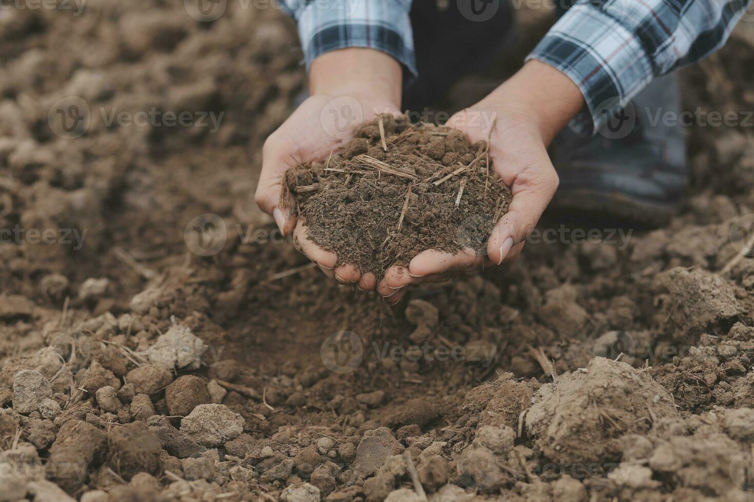 Symbol heart earth day. Handful of dirt hands heart shape. Farm organic earth. Farmer hands soil ground earth dirt garden soil farm ground. Male hands full of fertile land field agriculture concept photo