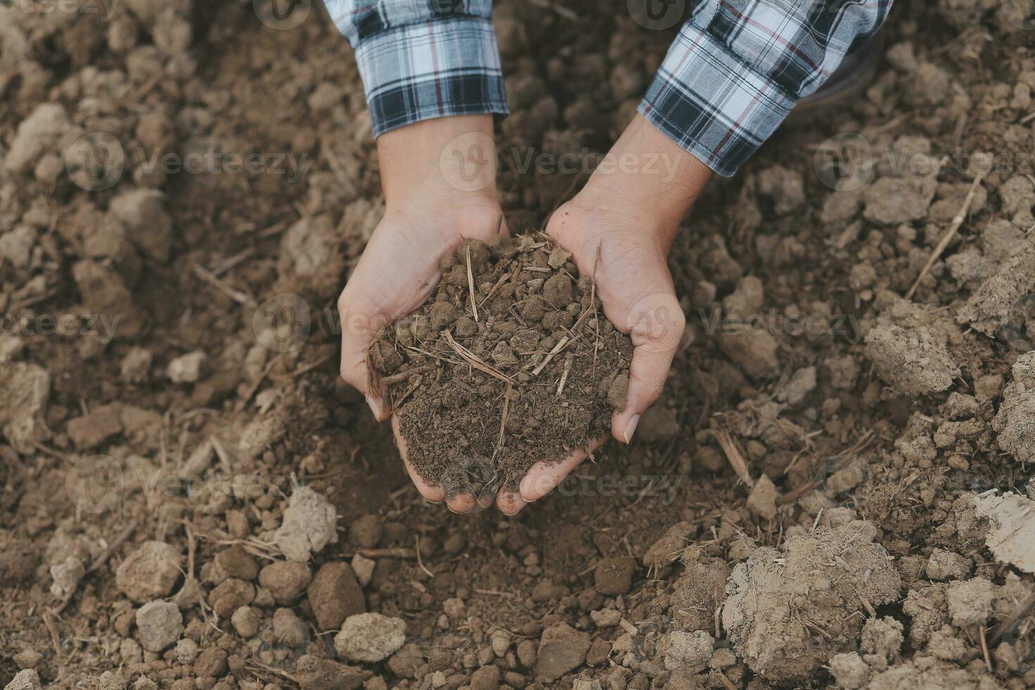 Symbol heart earth day. Handful of dirt hands heart shape. Farm organic earth. Farmer hands soil ground earth dirt garden soil farm ground. Male hands full of fertile land field agriculture concept photo