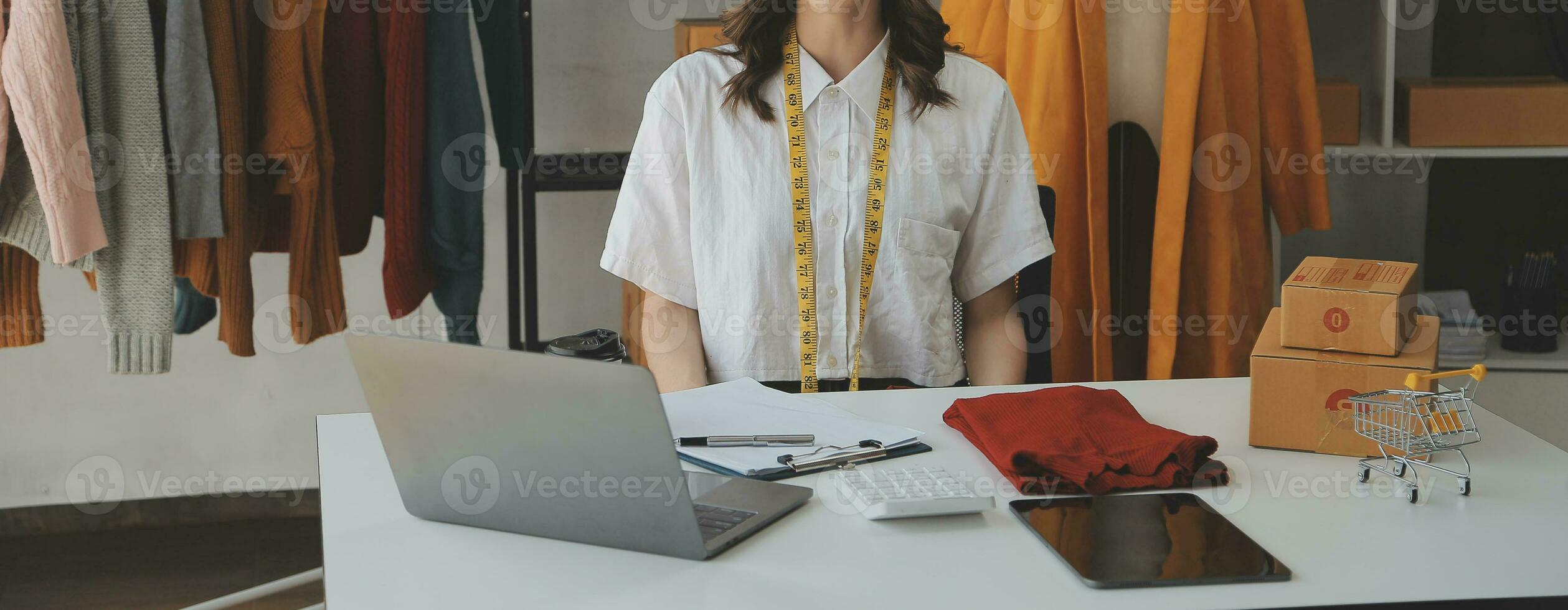 Online seller owner. Online shopping. Business Start up SME concept. Young startup entrepreneur small business owner working at home, packaging and delivery situation. photo