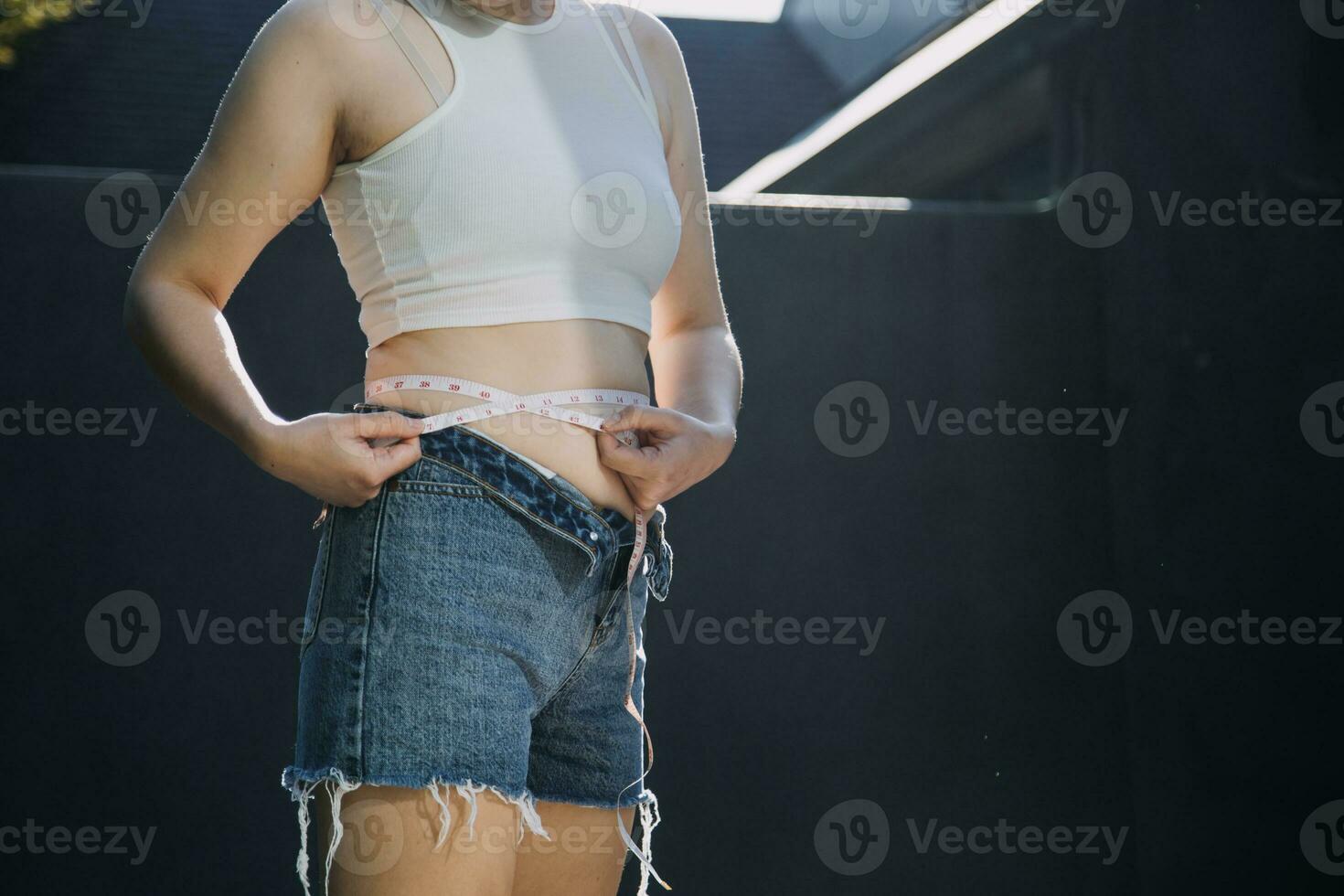 fat woman, fat belly, chubby, obese woman hand holding excessive belly fat with measure tape, woman diet lifestyle concept photo
