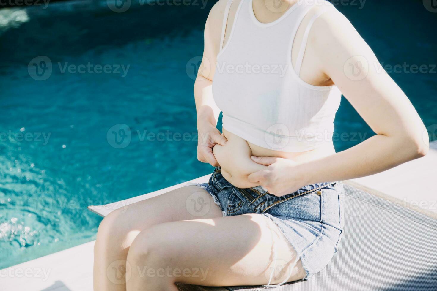 fat woman, fat belly, chubby, obese woman hand holding excessive belly fat with measure tape, woman diet lifestyle concept photo
