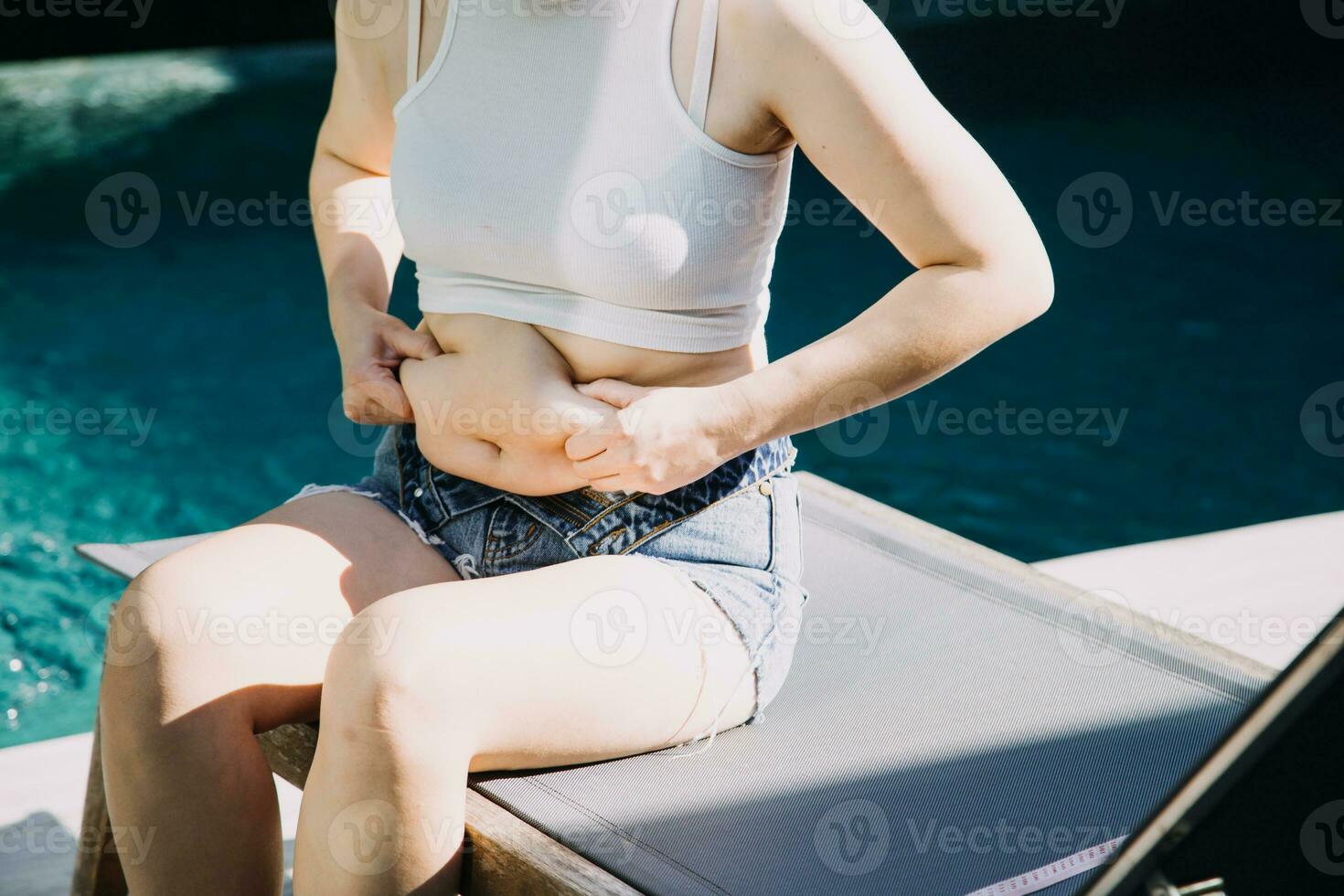 fat woman, fat belly, chubby, obese woman hand holding excessive belly fat with measure tape, woman diet lifestyle concept photo