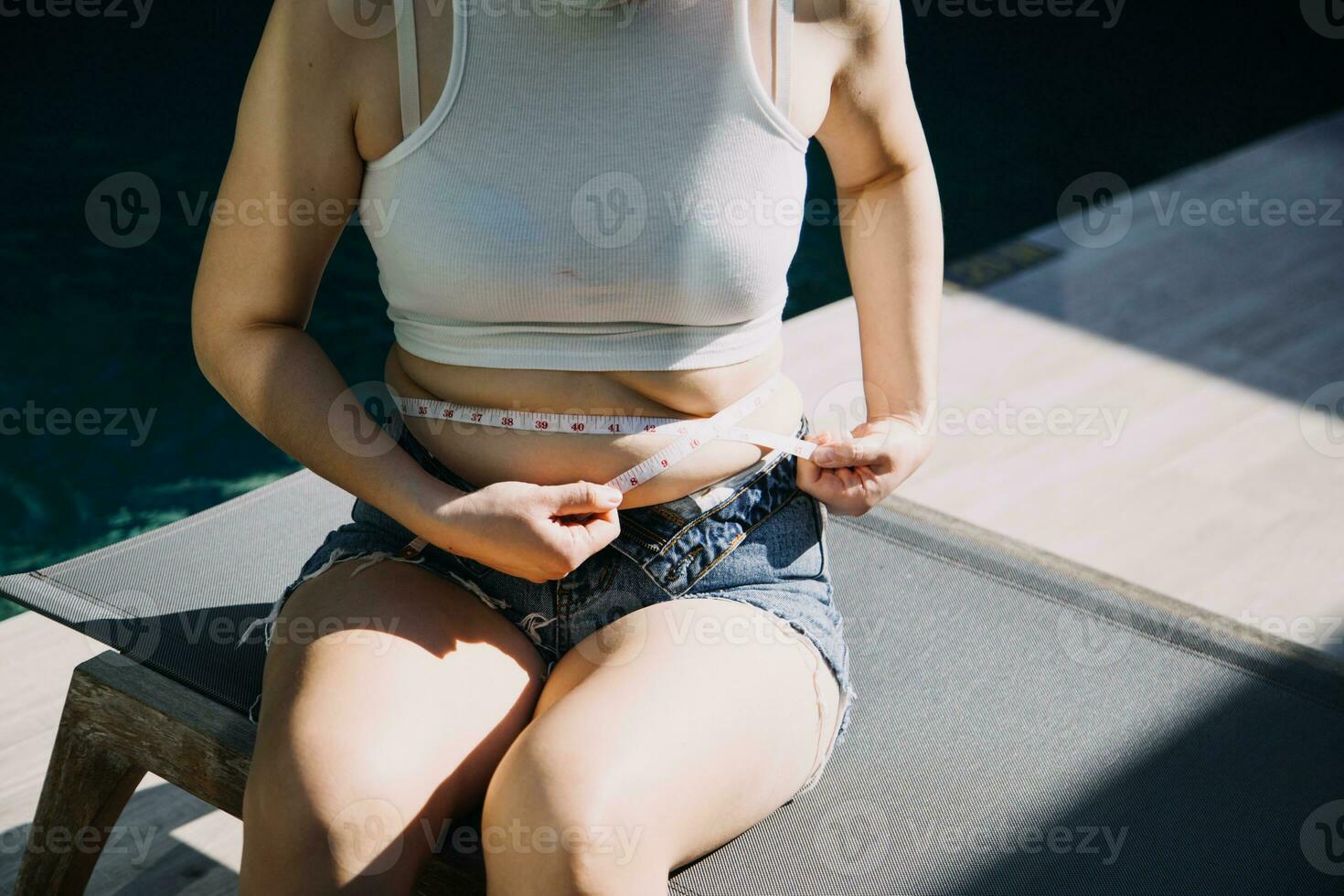 fat woman, fat belly, chubby, obese woman hand holding excessive belly fat with measure tape, woman diet lifestyle concept photo