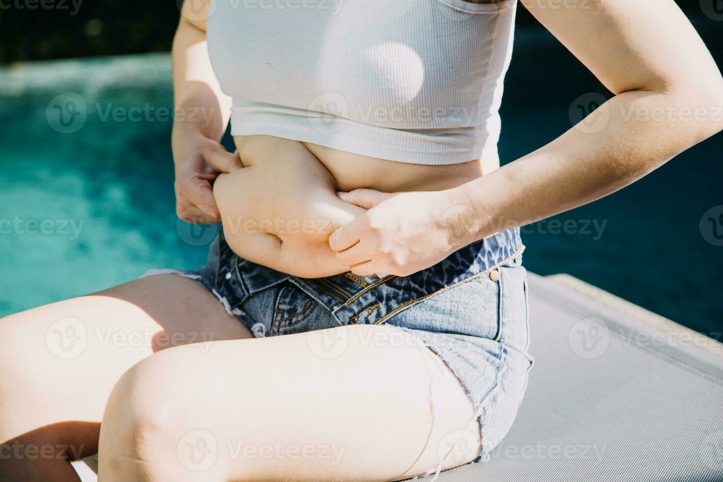 fat woman, fat belly, chubby, obese woman hand holding excessive belly fat with measure tape, woman diet lifestyle concept photo