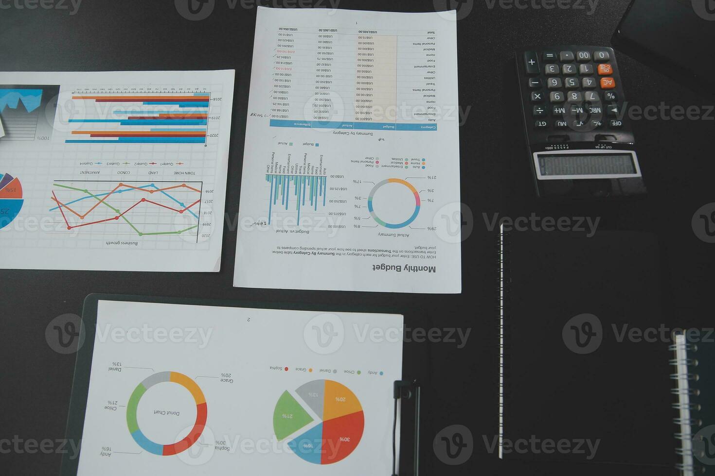 Financial analysts analyze business financial reports on a digital tablet planning investment project during a discussion at a meeting of corporate showing the results of their successful teamwork. photo