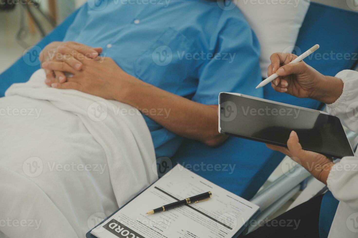 Close up of Female Doctor using stethoscope putting beat heart diagnose with patient in examination room at a hospital, check-up body, Medical and Health Care Concept. photo