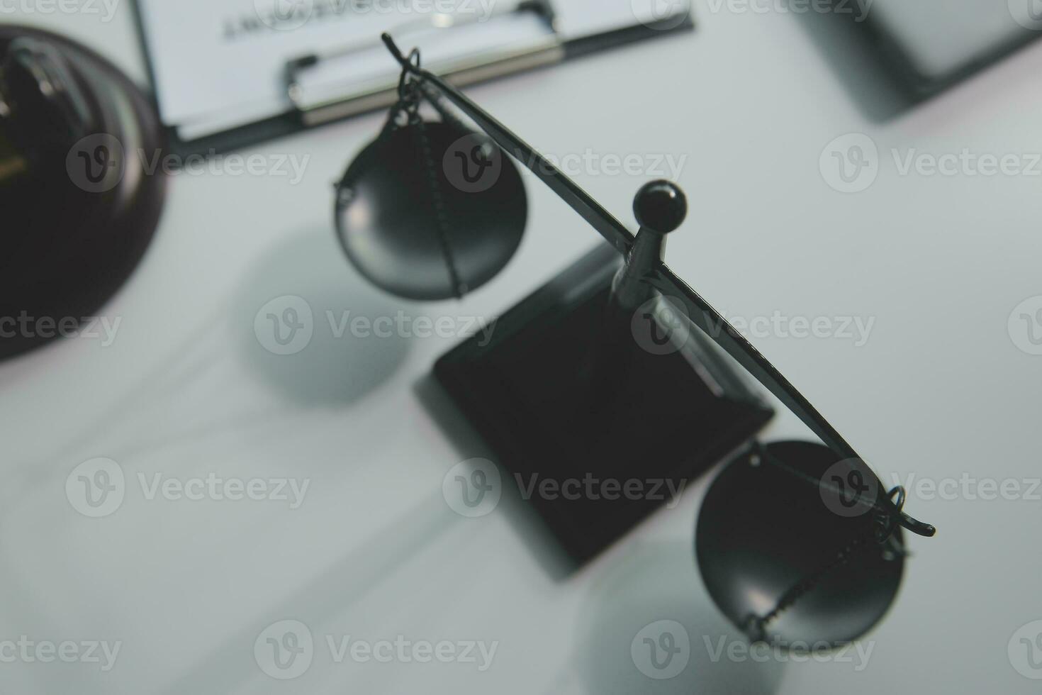 Business and lawyers discussing contract papers with brass scale on desk in office. Law, legal services, advice, justice and law concept picture with film grain effect photo
