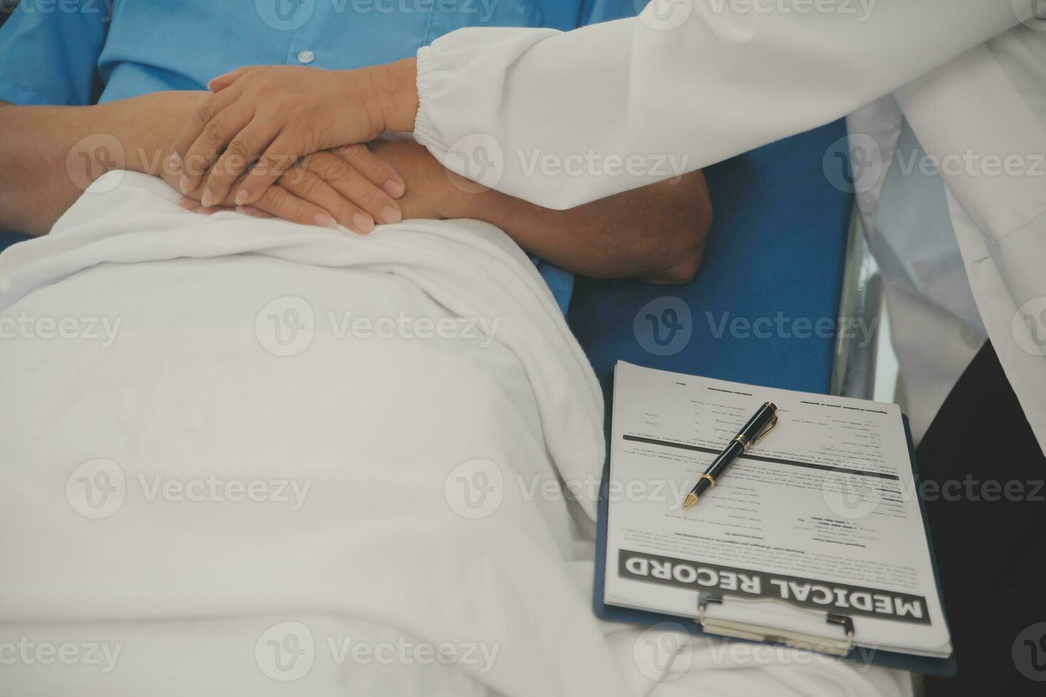 Close up of Female Doctor using stethoscope putting beat heart diagnose with patient in examination room at a hospital, check-up body, Medical and Health Care Concept. photo