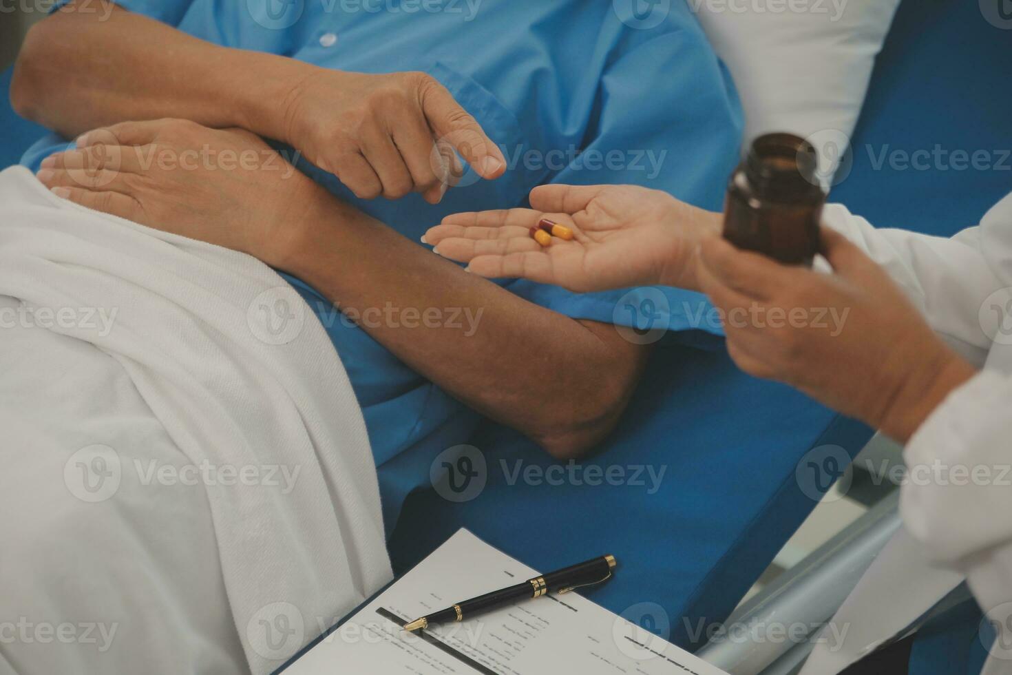 Close up of Female Doctor using stethoscope putting beat heart diagnose with patient in examination room at a hospital, check-up body, Medical and Health Care Concept. photo