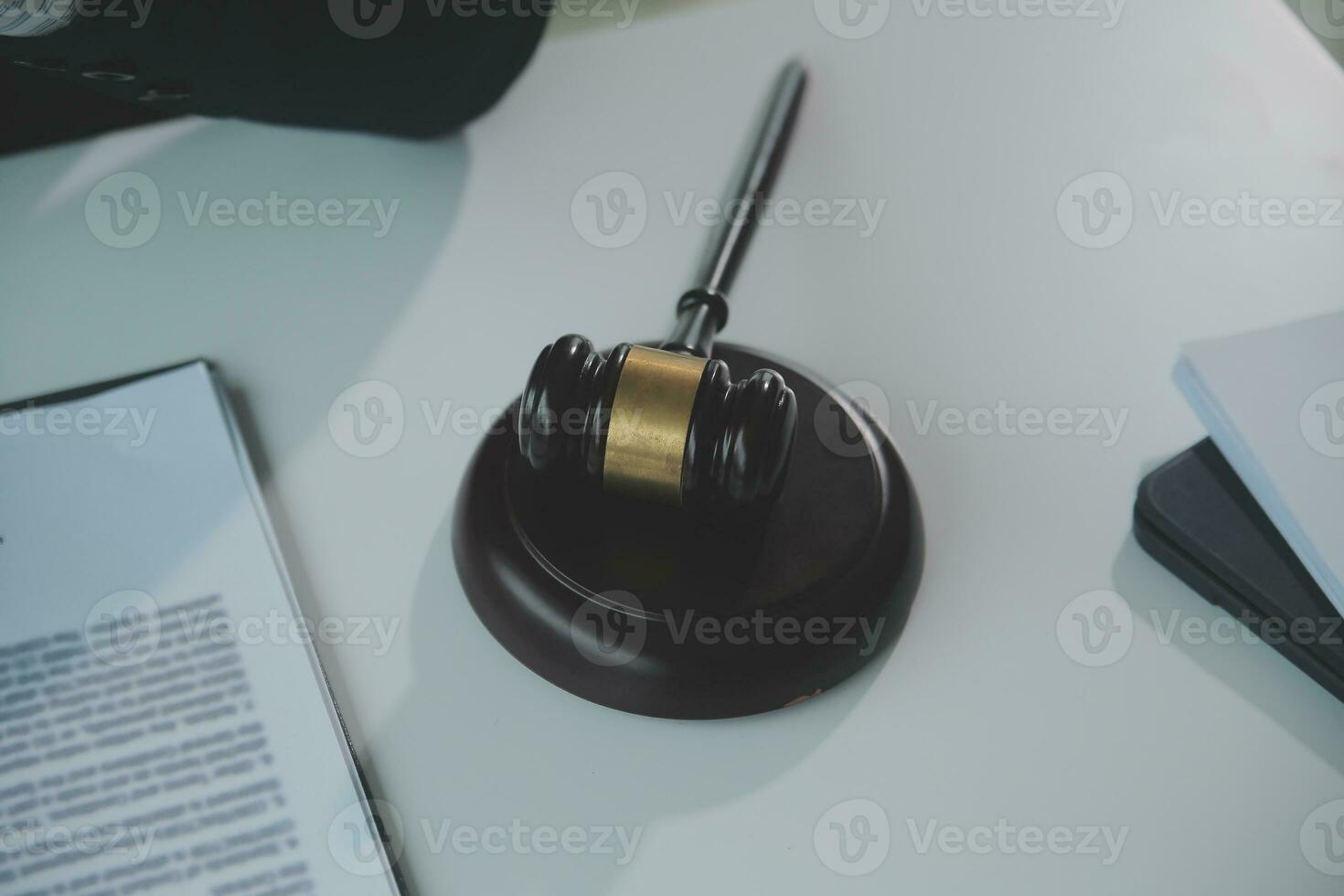 Business and lawyers discussing contract papers with brass scale on desk in office. Law, legal services, advice, justice and law concept picture with film grain effect photo