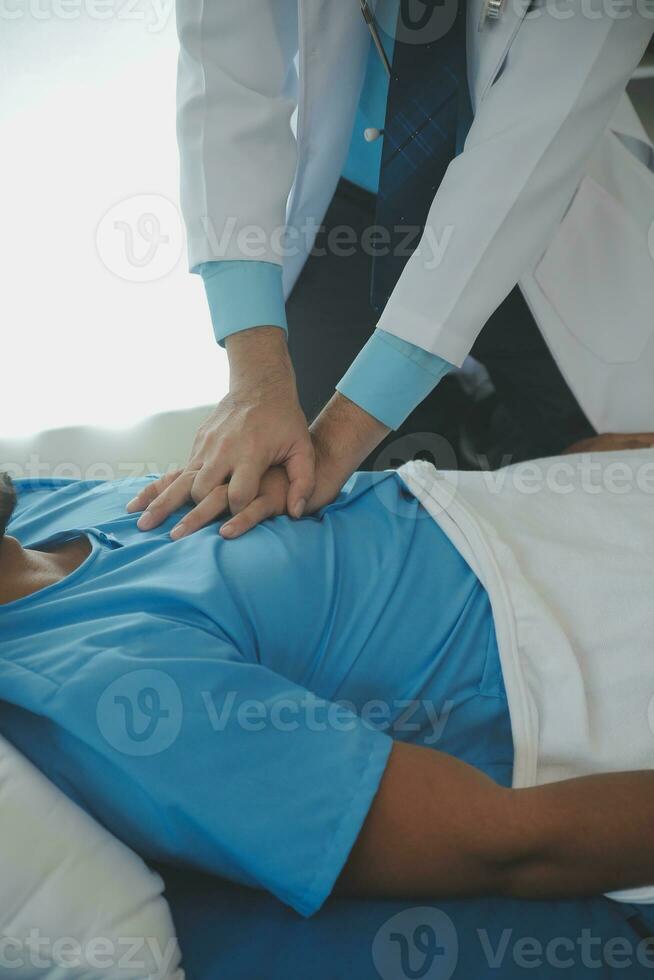 Medical professionals provide assistance to patients with unconscious, using an AED, by placing the electrode in the correct position. medical and healthcare concept. photo