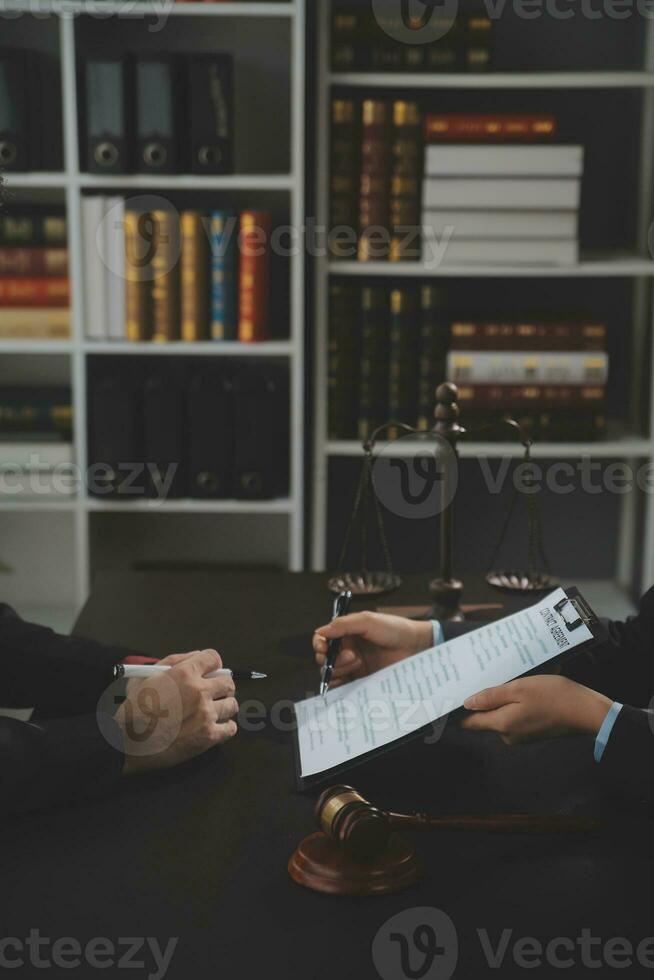 female lawyers working at the law firms. Judge gavel with scales of justice. Legal law, lawyer, advice and justice concept. photo