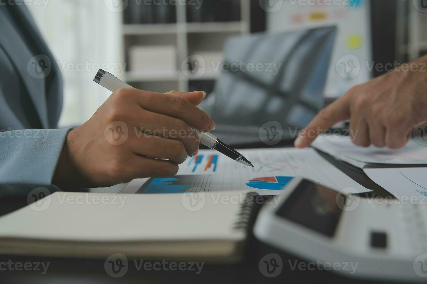 Financial Business team present. Business man hands hold documents with financial statistic stock photo, discussion, and analysis report data the charts and graphs. Finance Financial concept photo