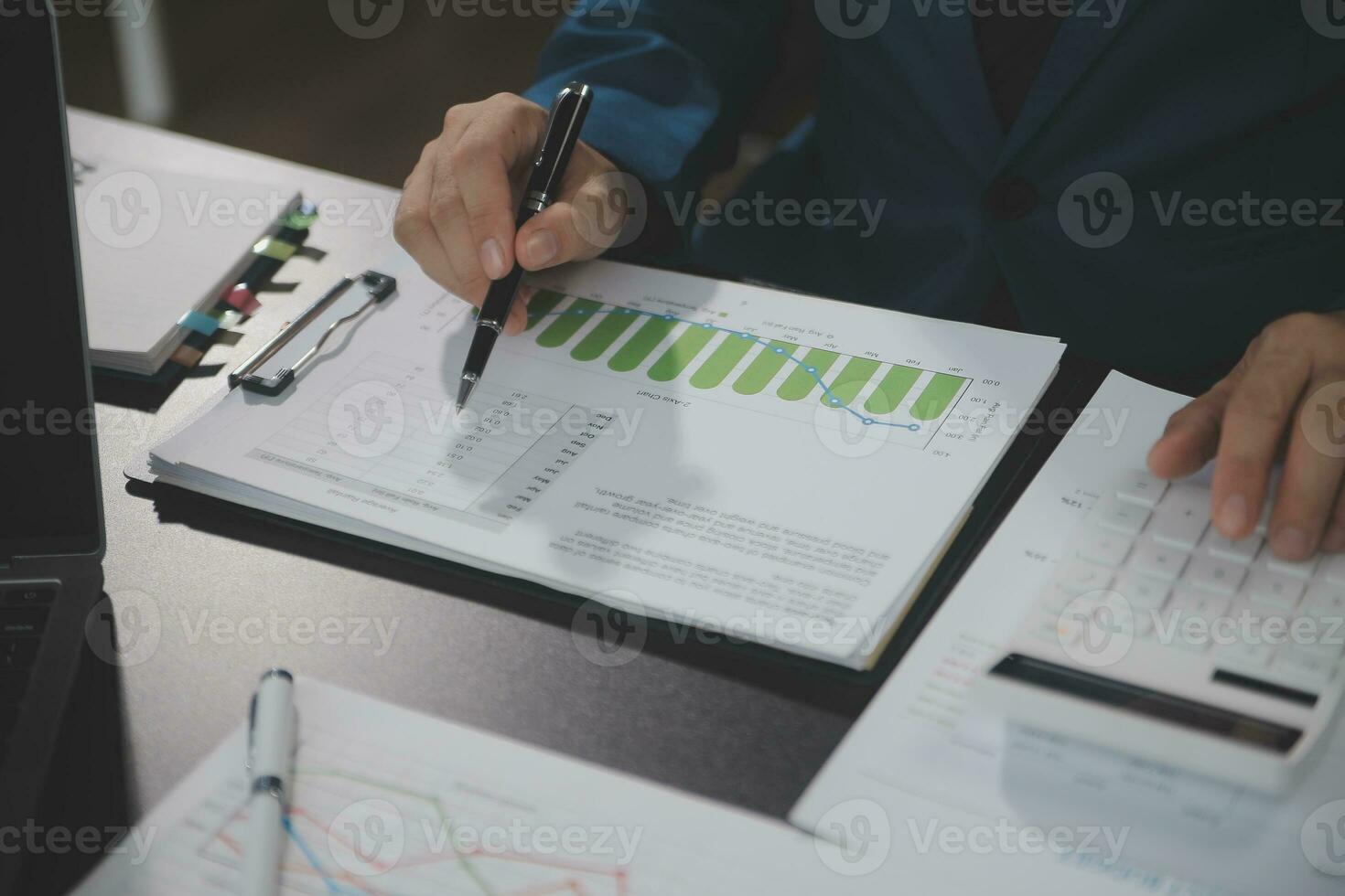 Financial Business team present. Business man hands hold documents with financial statistic stock photo, discussion, and analysis report data the charts and graphs. Finance Financial concept photo
