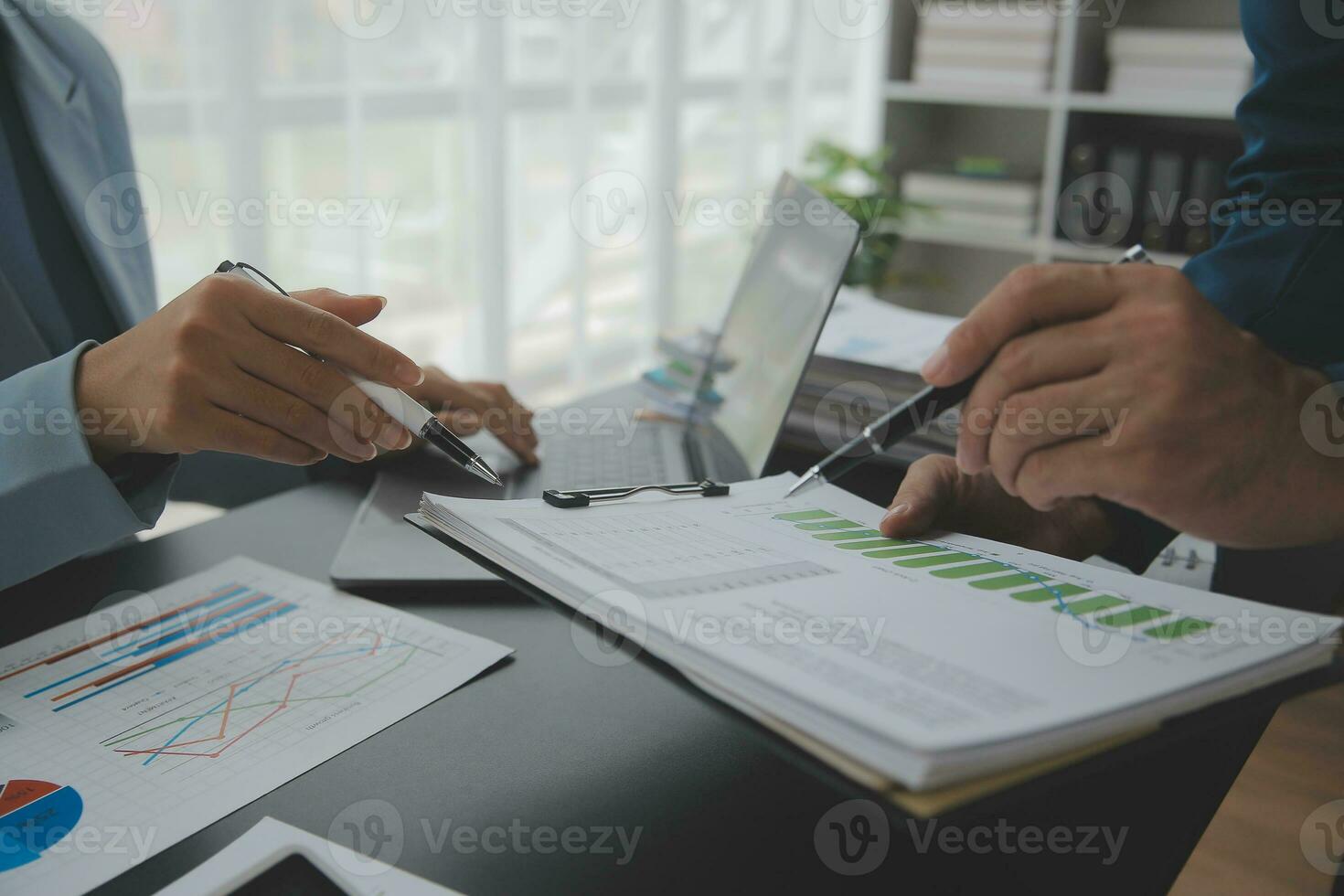 Financial Business team present. Business man hands hold documents with financial statistic stock photo, discussion, and analysis report data the charts and graphs. Finance Financial concept photo