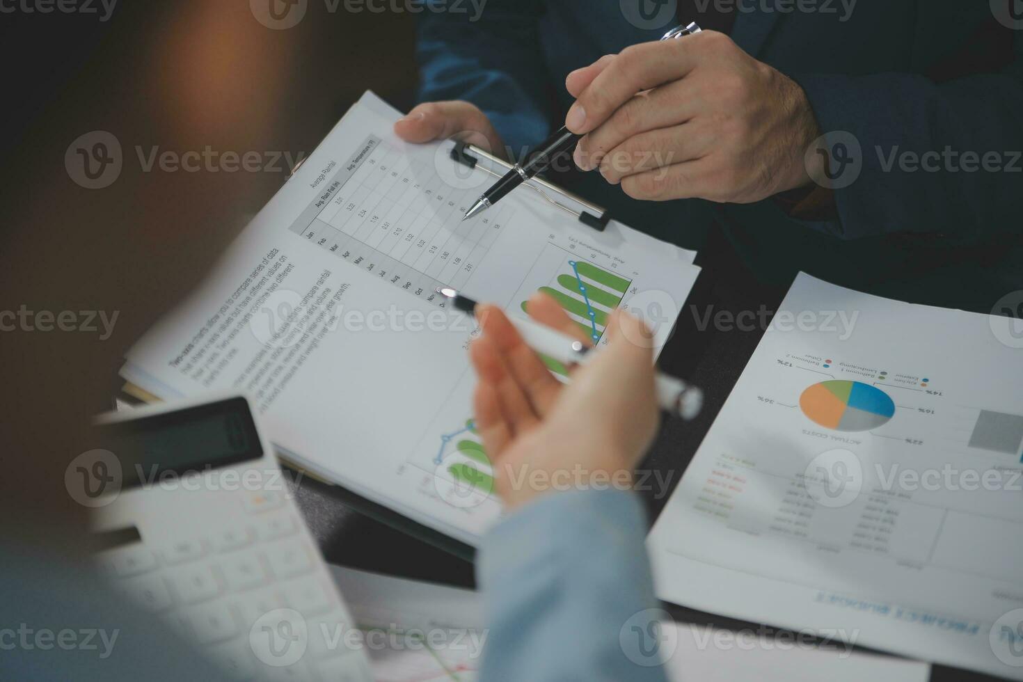Financial Business team present. Business man hands hold documents with financial statistic stock photo, discussion, and analysis report data the charts and graphs. Finance Financial concept photo