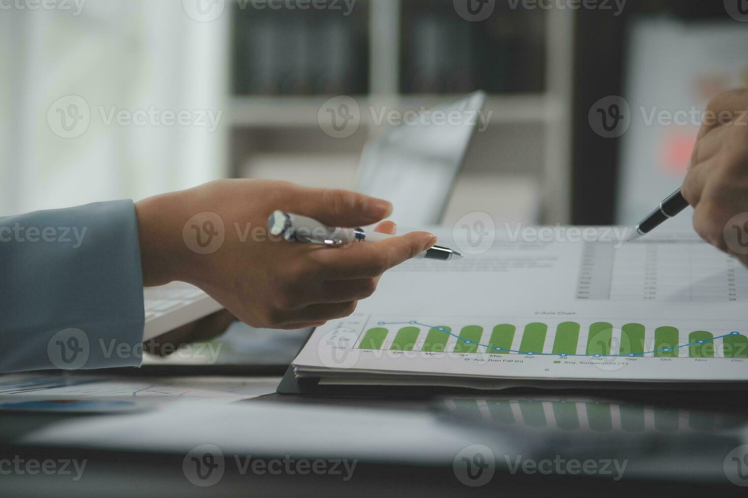 Financial Business team present. Business man hands hold documents with financial statistic stock photo, discussion, and analysis report data the charts and graphs. Finance Financial concept photo