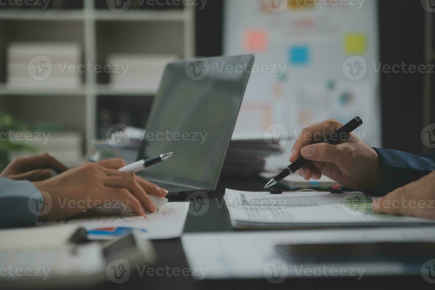 Financial Business team present. Business man hands hold documents with financial statistic stock photo, discussion, and analysis report data the charts and graphs. Finance Financial concept photo