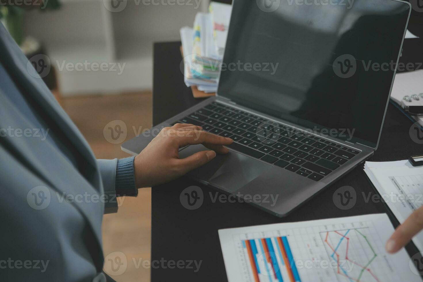 Financial Business team present. Business man hands hold documents with financial statistic stock photo, discussion, and analysis report data the charts and graphs. Finance Financial concept photo