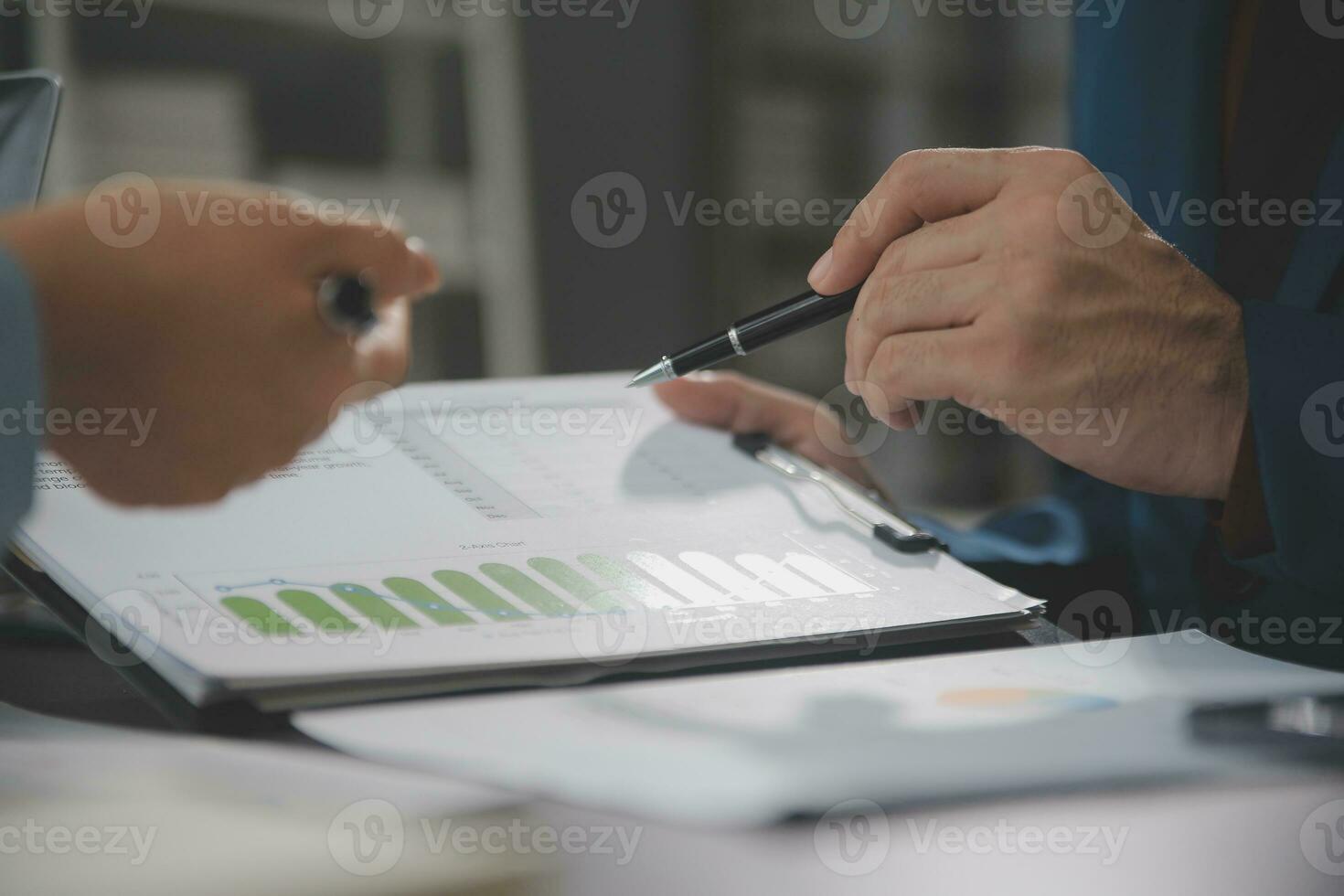 Financial Business team present. Business man hands hold documents with financial statistic stock photo, discussion, and analysis report data the charts and graphs. Finance Financial concept photo