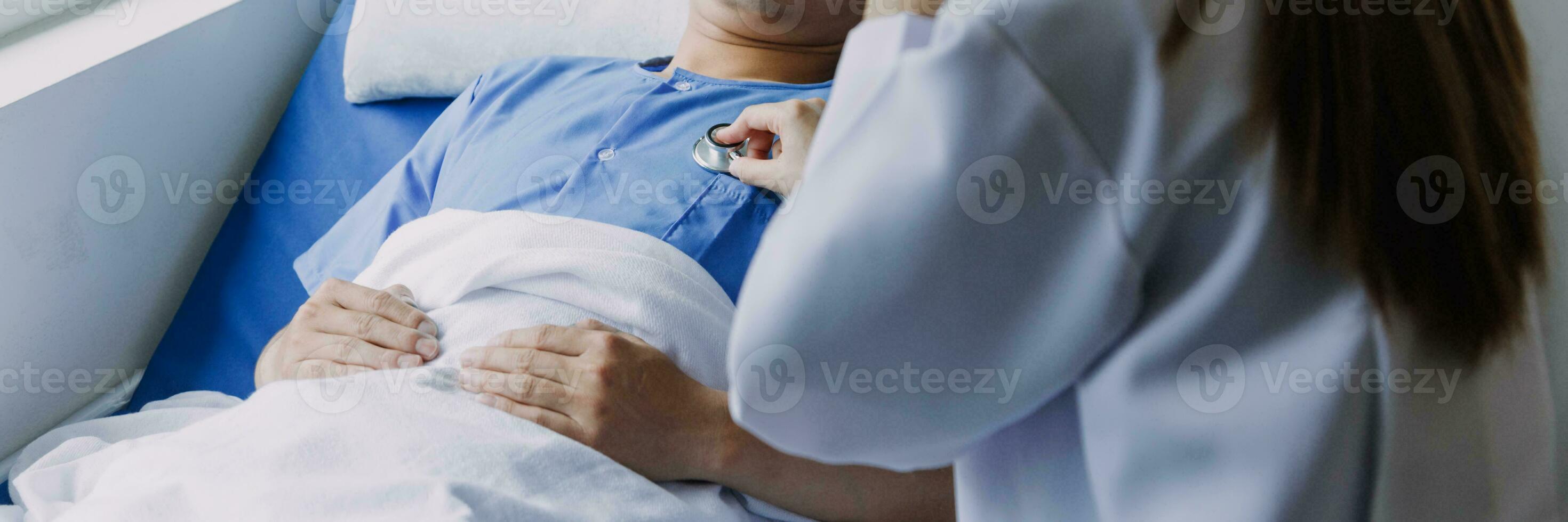 Professional female doctor smiles and shows positive examination results to young, joyful man. Handsome, happy guy with glasses at doctor's appointment in modern office of medical institution. photo
