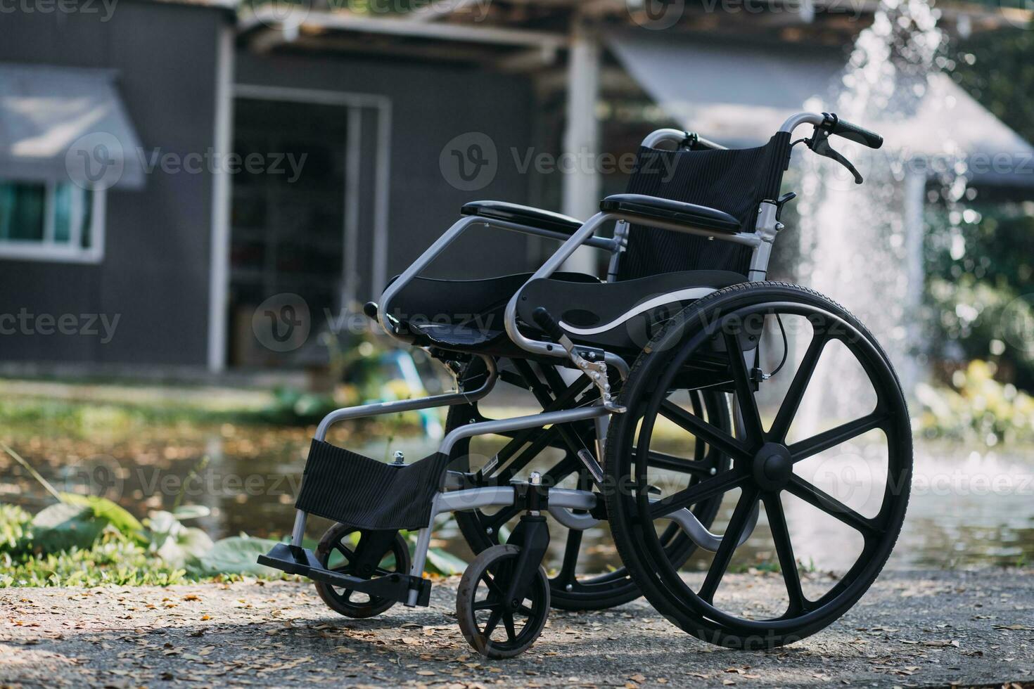 Asian young woman nurse at nursing home take care disabled senior man. Caregiver doctor serve physical therapy for older elderly patient to exercise and practice walking on walker or cane at backyard. photo