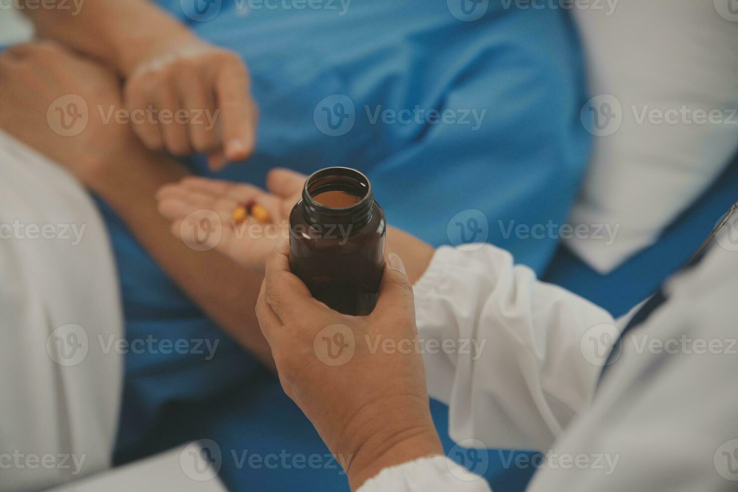 Close up of Female Doctor using stethoscope putting beat heart diagnose with patient in examination room at a hospital, check-up body, Medical and Health Care Concept. photo