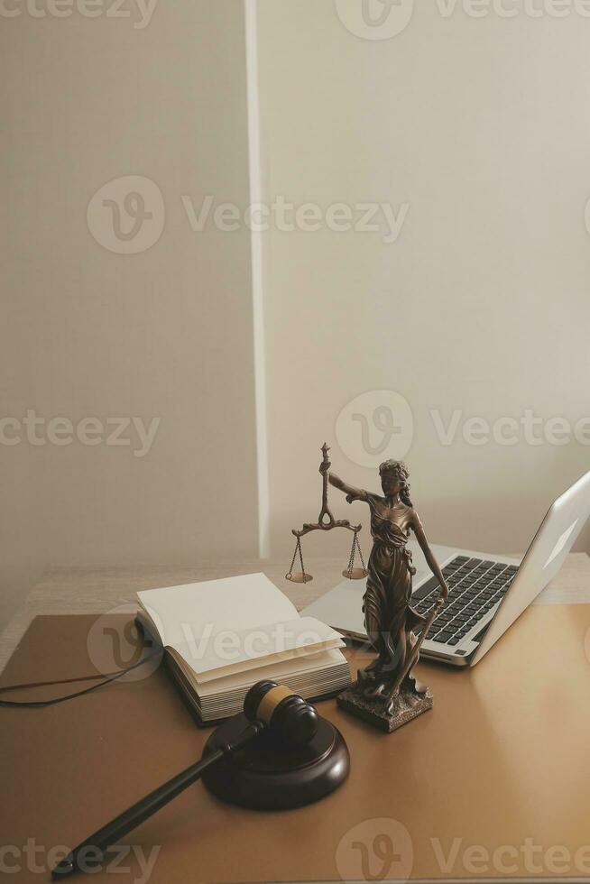 Business and lawyers discussing contract papers with brass scale on desk in office. Law, legal services, advice, justice and law concept picture with film grain effect photo
