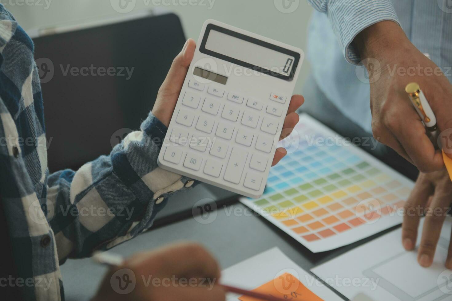 Close up ux developer and ui designer brainstorming about mobile app interface wireframe design on table with customer breif and color code at modern office.Creative digital development agency photo