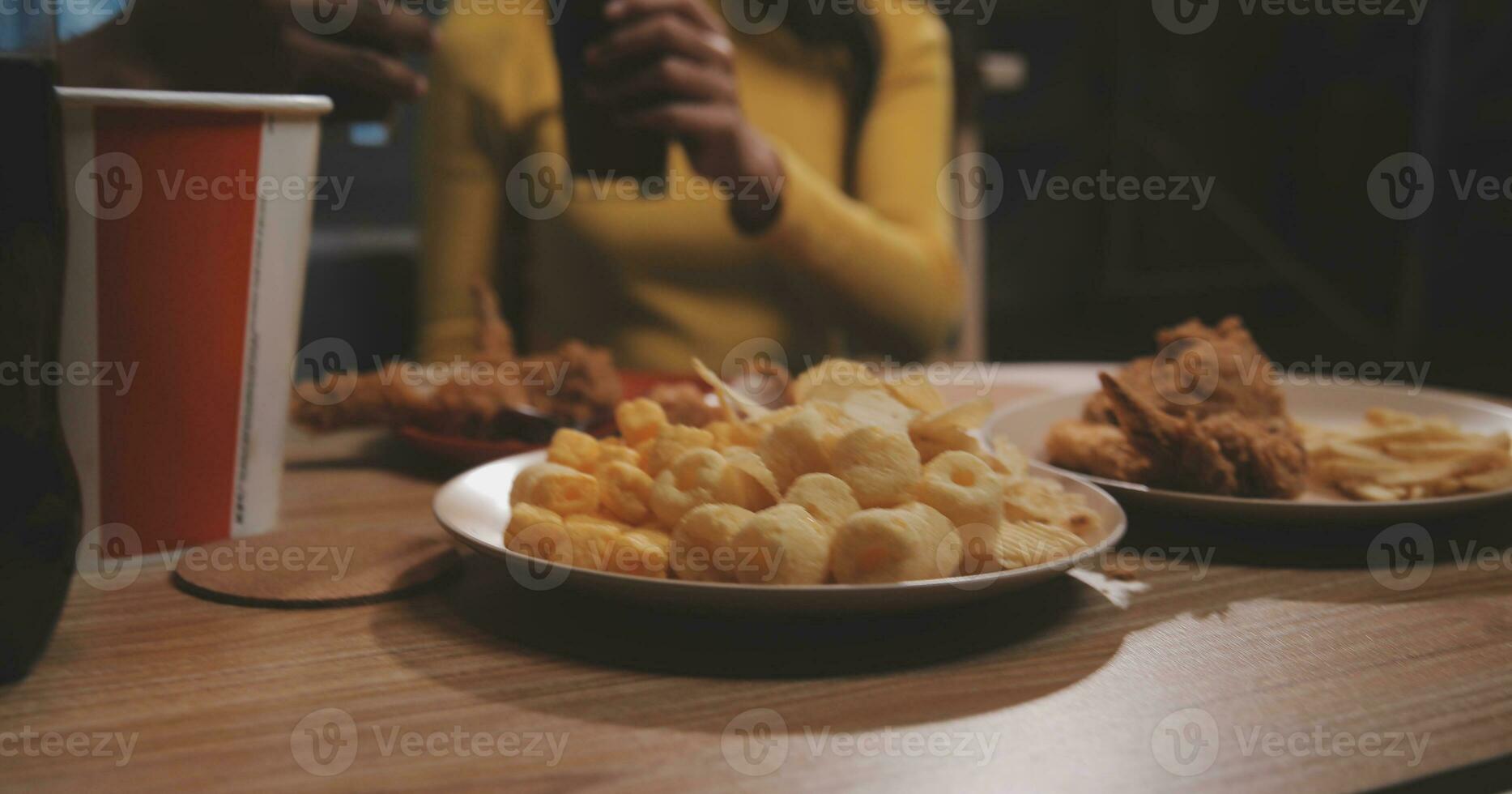 fat woman bite piece of pizza,overweight female is eating fast foods,asian girl is hungry photo