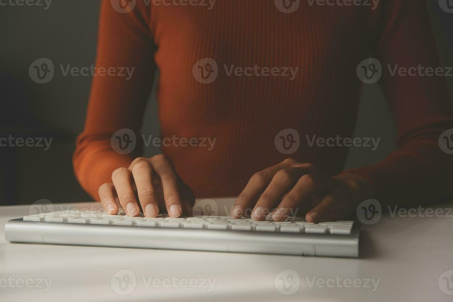 Asian Businesswoman Using laptop computer and working at office with calculator document on desk, doing planning analyzing the financial report, business plan investment, finance analysis concept. photo
