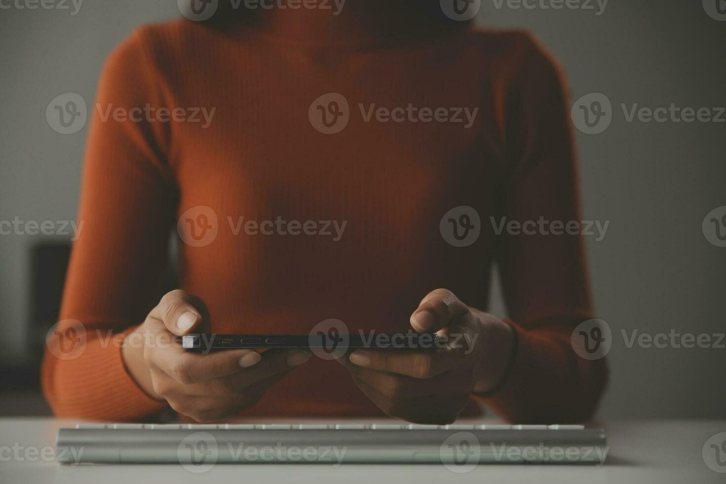 Asian Businesswoman Using laptop computer and working at office with calculator document on desk, doing planning analyzing the financial report, business plan investment, finance analysis concept. photo