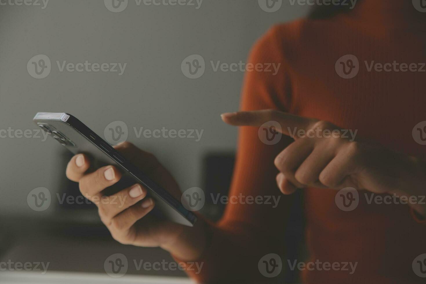 Asian Businesswoman Using laptop computer and working at office with calculator document on desk, doing planning analyzing the financial report, business plan investment, finance analysis concept. photo