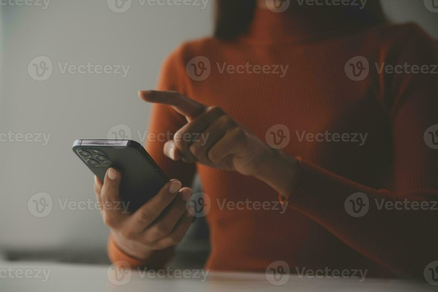 Asian Businesswoman Using laptop computer and working at office with calculator document on desk, doing planning analyzing the financial report, business plan investment, finance analysis concept. photo