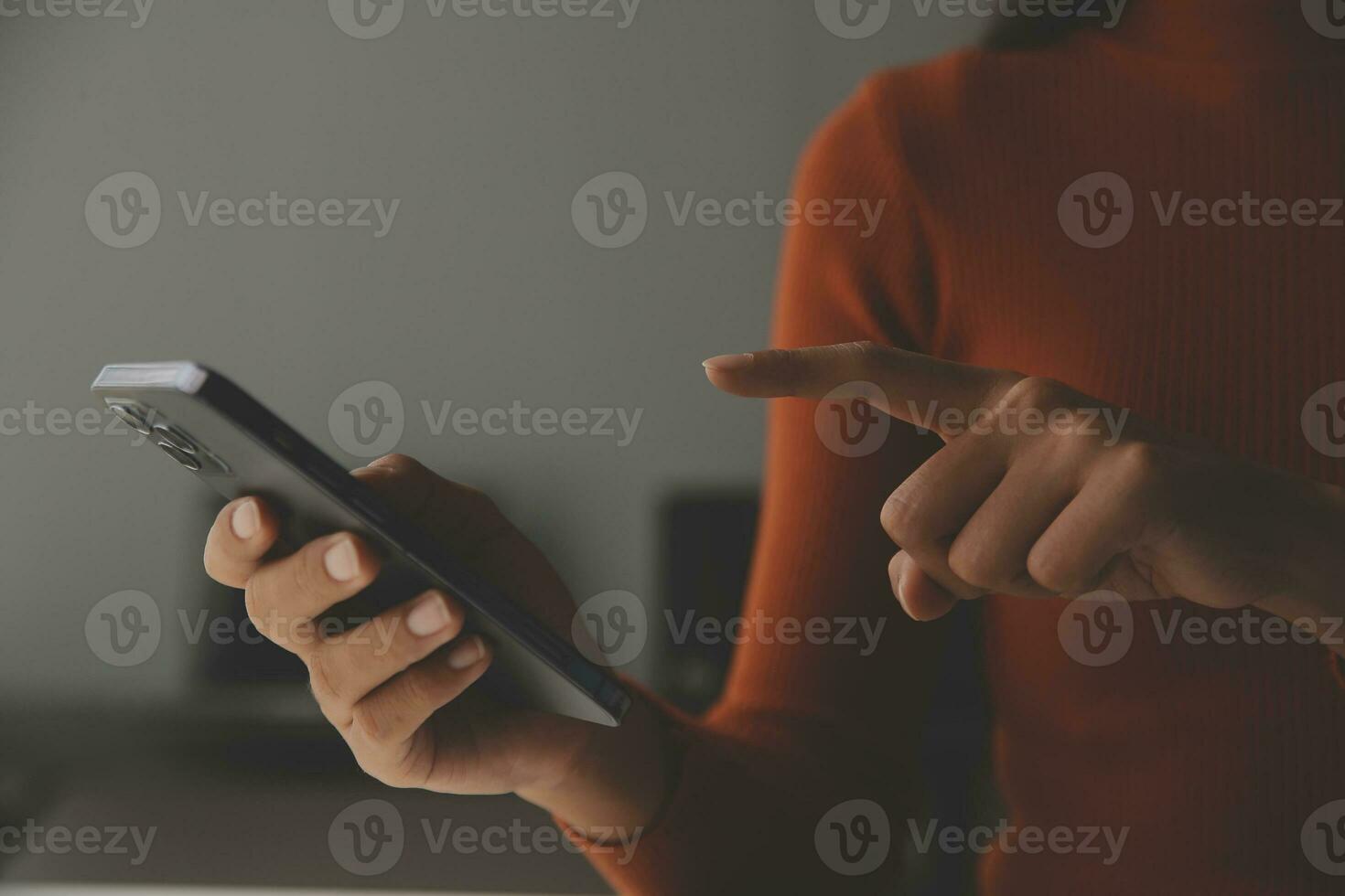 Asian Businesswoman Using laptop computer and working at office with calculator document on desk, doing planning analyzing the financial report, business plan investment, finance analysis concept. photo