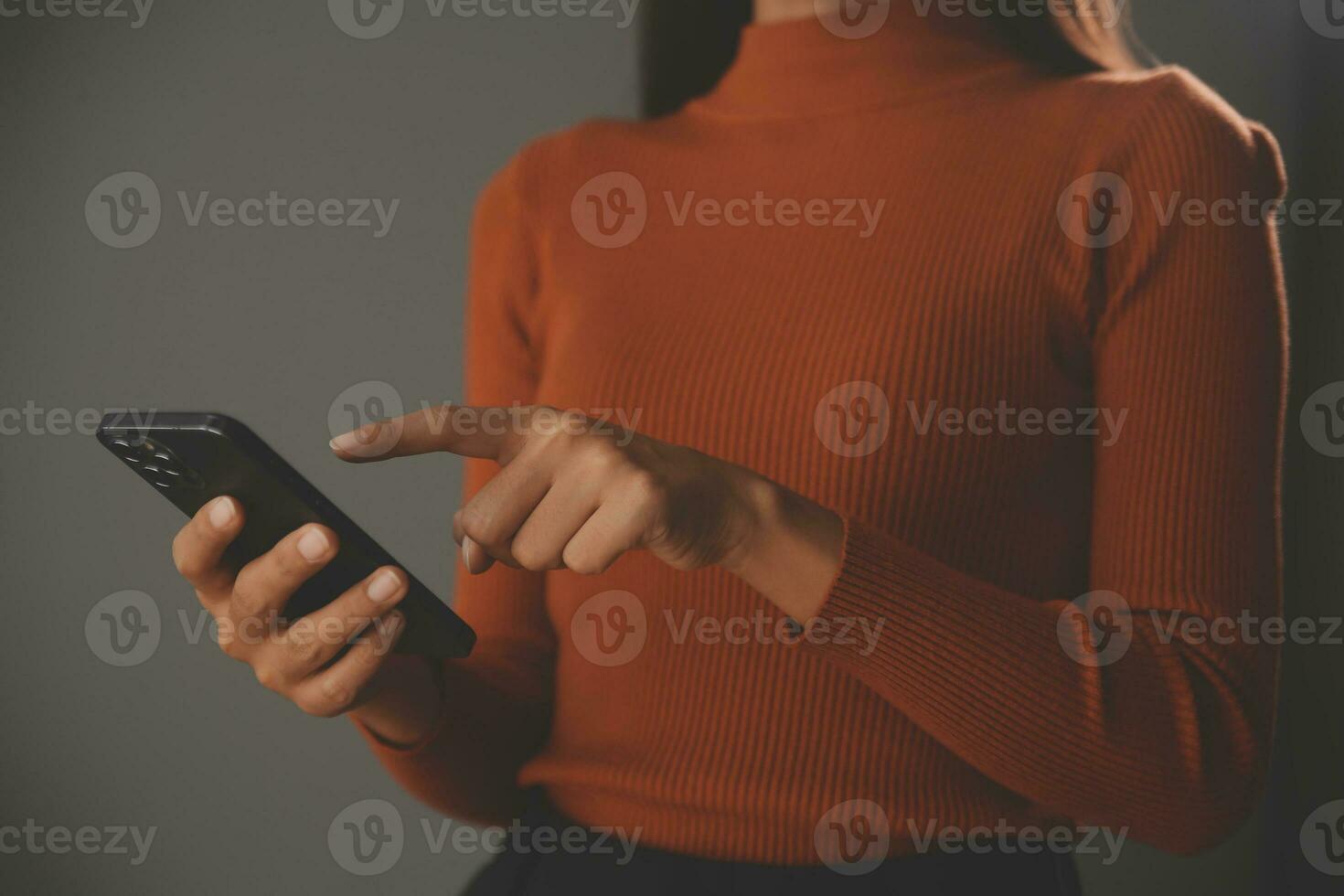 Asian Businesswoman Using laptop computer and working at office with calculator document on desk, doing planning analyzing the financial report, business plan investment, finance analysis concept. photo