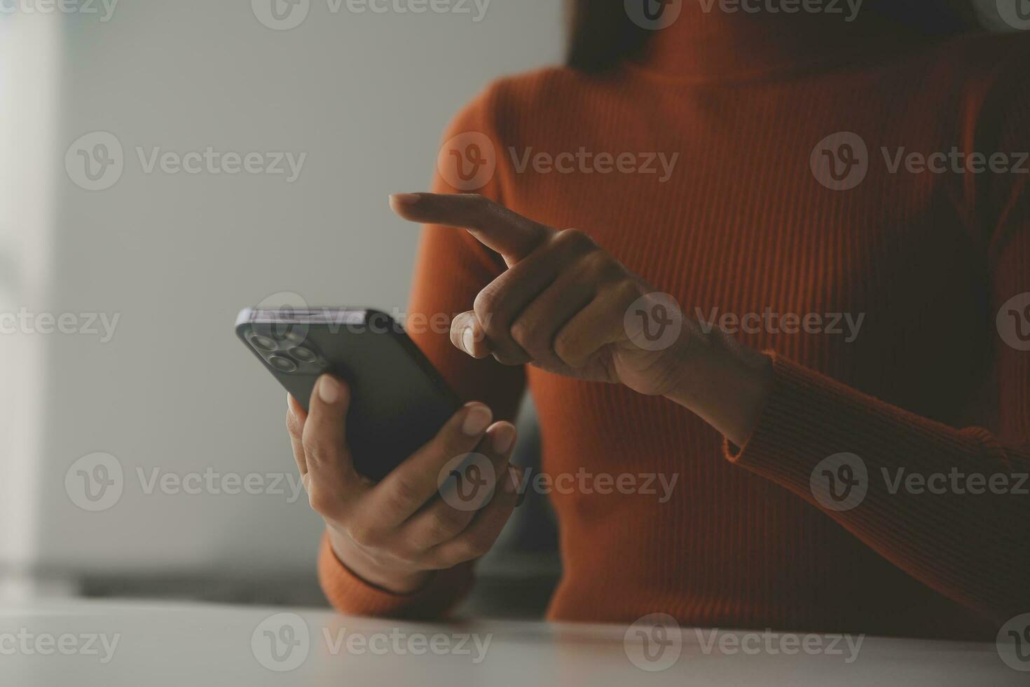 Asian Businesswoman Using laptop computer and working at office with calculator document on desk, doing planning analyzing the financial report, business plan investment, finance analysis concept. photo