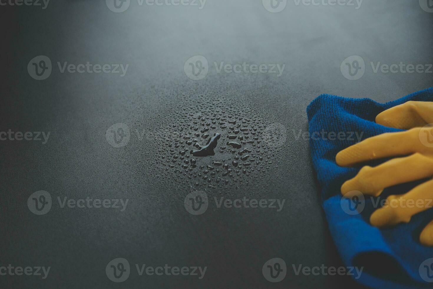 Office Cleaning Service. Janitor Spraying Desk. Workplace Hygiene photo