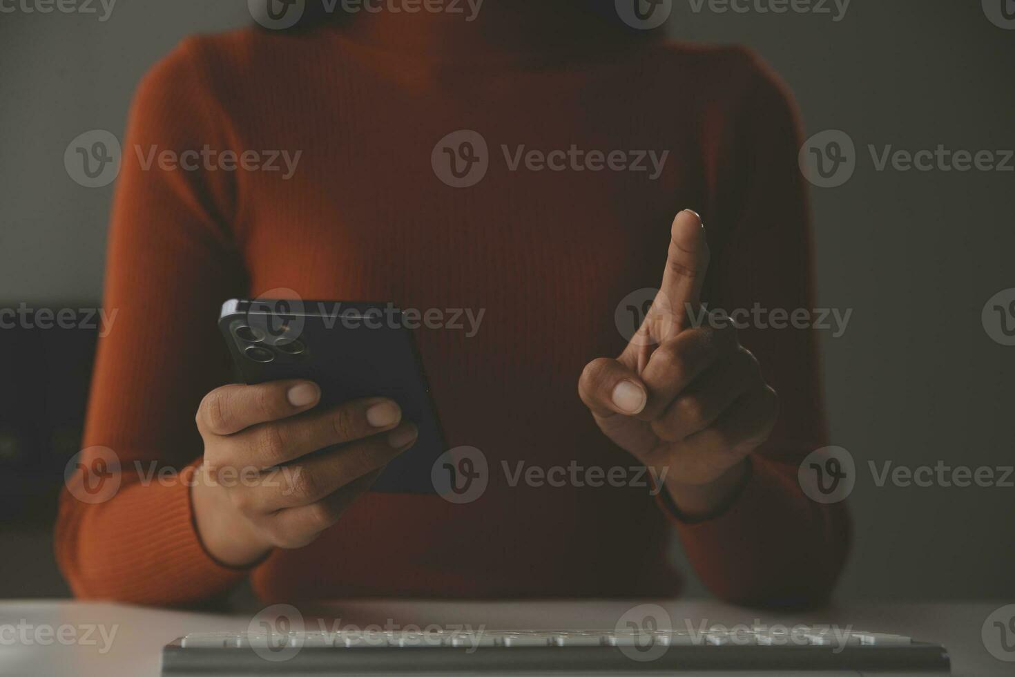 Asian Businesswoman Using laptop computer and working at office with calculator document on desk, doing planning analyzing the financial report, business plan investment, finance analysis concept. photo