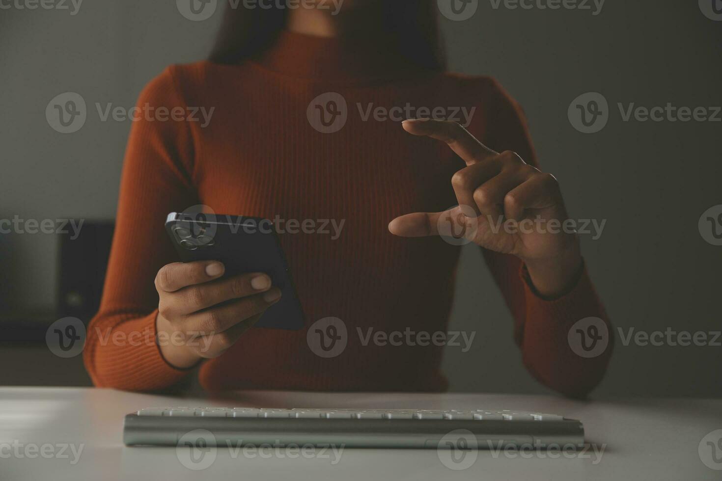 Asian Businesswoman Using laptop computer and working at office with calculator document on desk, doing planning analyzing the financial report, business plan investment, finance analysis concept. photo