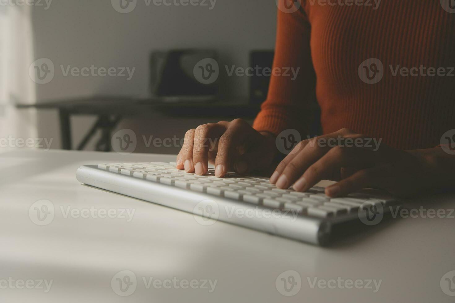 Asian Businesswoman Using laptop computer and working at office with calculator document on desk, doing planning analyzing the financial report, business plan investment, finance analysis concept. photo