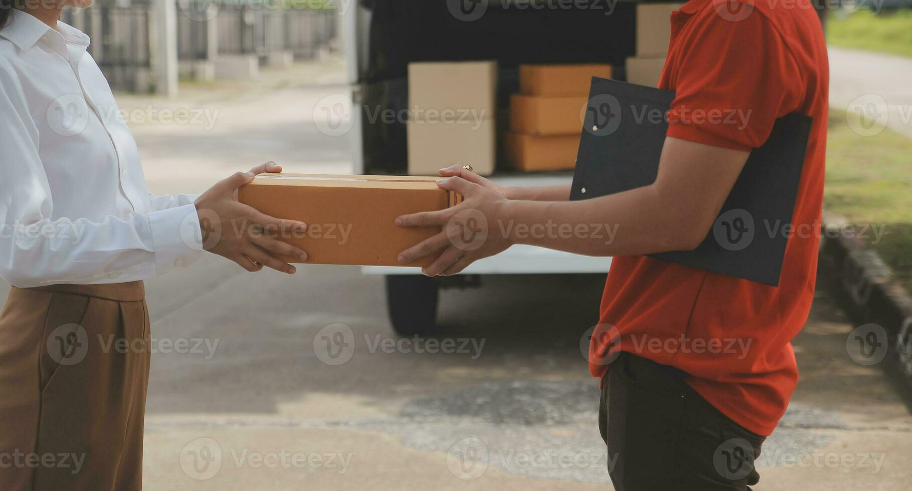 Asian Woman Receiving Product from delivery man at Home, Young Owner Woman Order Product from Smartphone Application, Woman with Online Business or SME Concept. photo