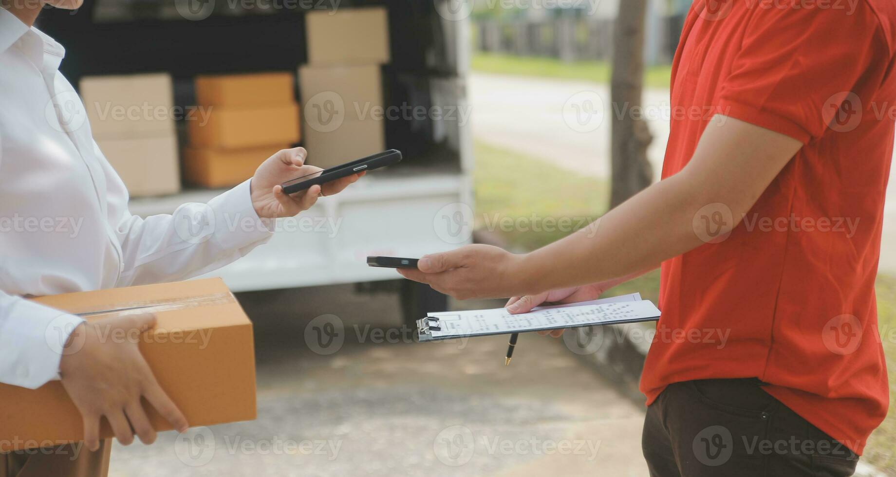 Asian Woman Receiving Product from delivery man at Home, Young Owner Woman Order Product from Smartphone Application, Woman with Online Business or SME Concept. photo
