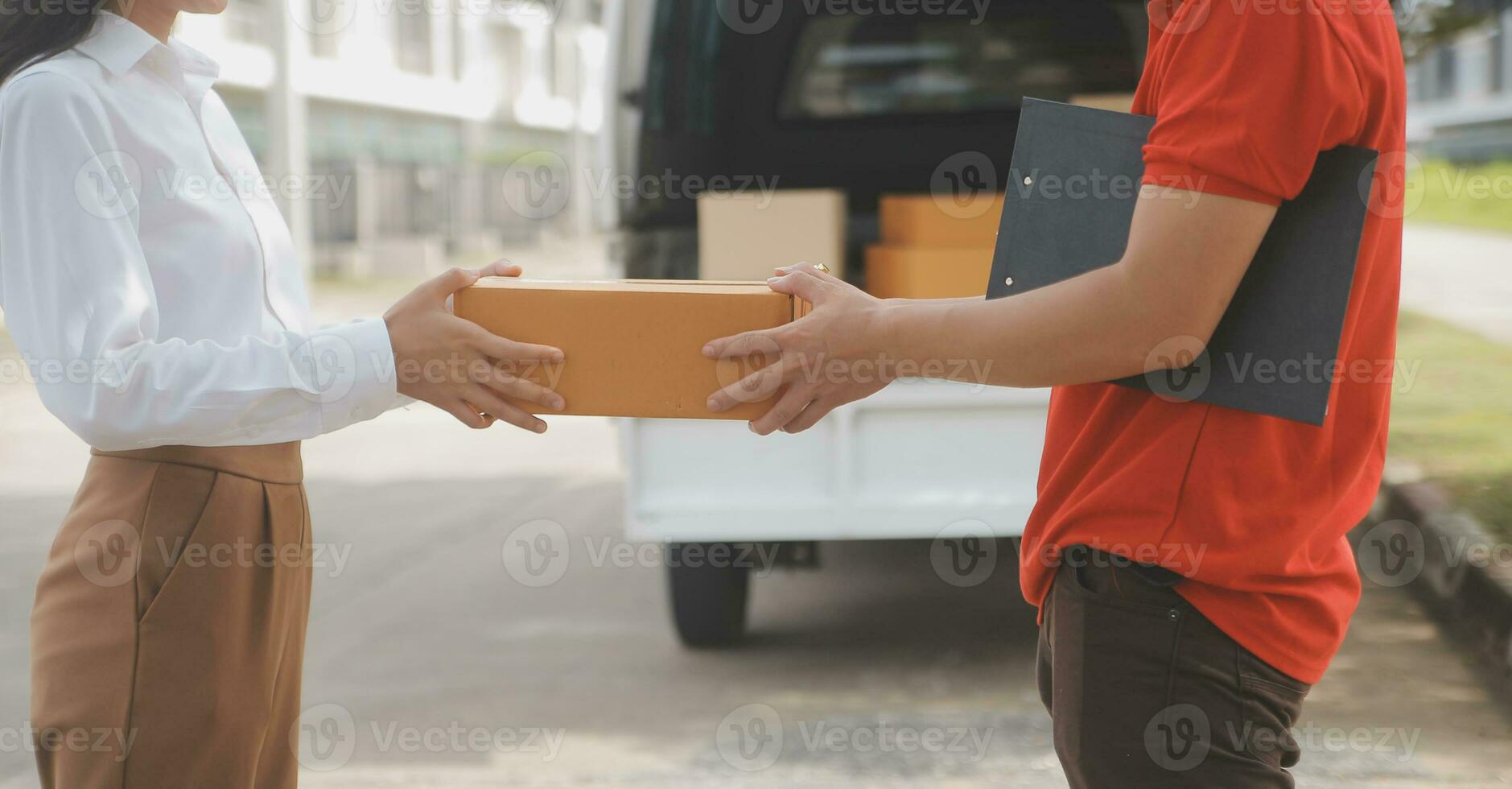 Asian Woman Receiving Product from delivery man at Home, Young Owner Woman Order Product from Smartphone Application, Woman with Online Business or SME Concept. photo