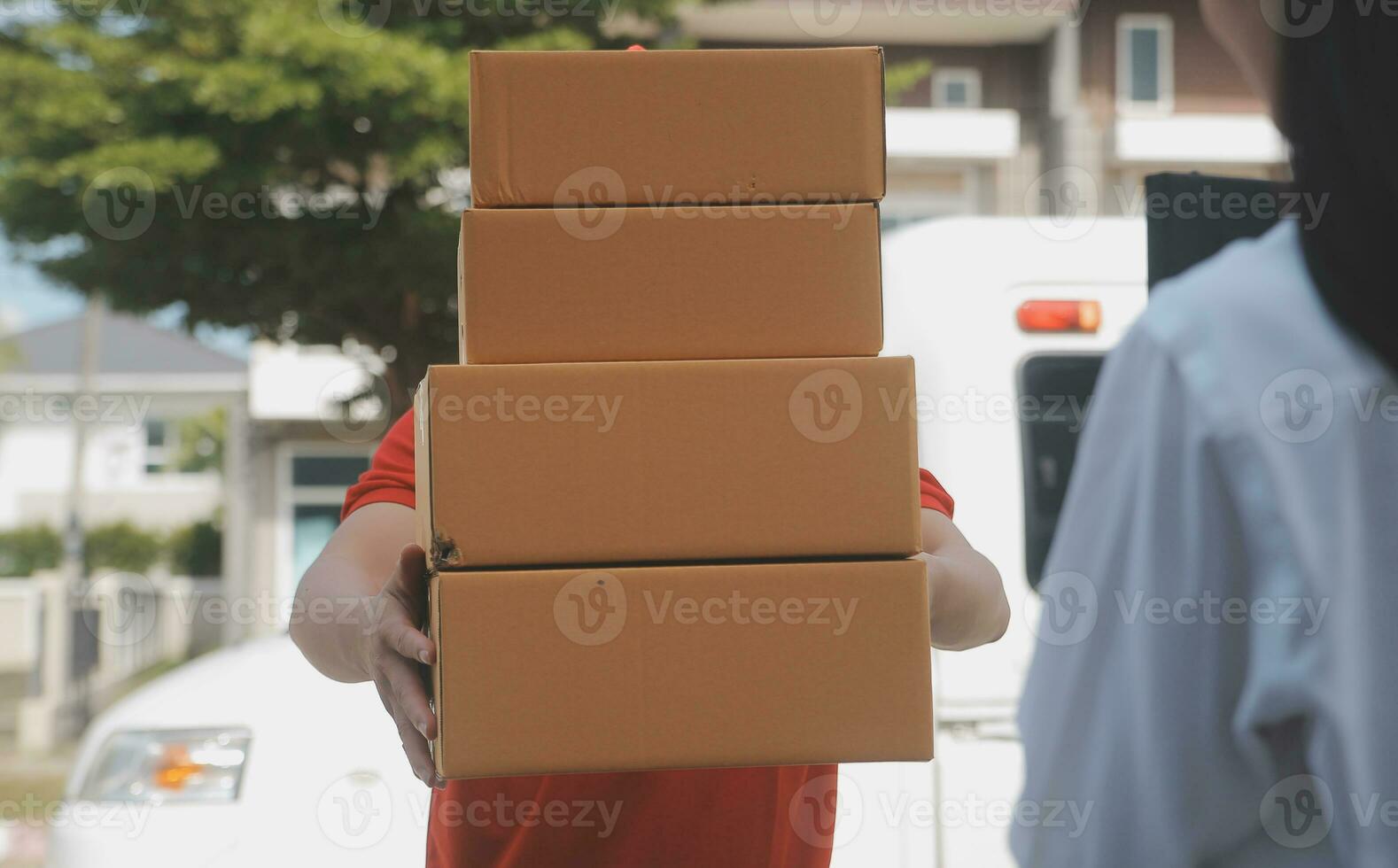 Asian Woman Receiving Product from delivery man at Home, Young Owner Woman Order Product from Smartphone Application, Woman with Online Business or SME Concept. photo