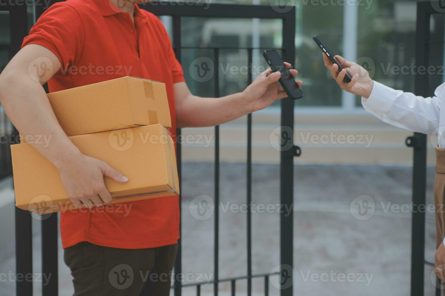Asian Woman Receiving Product from delivery man at Home, Young Owner Woman Order Product from Smartphone Application, Woman with Online Business or SME Concept. photo