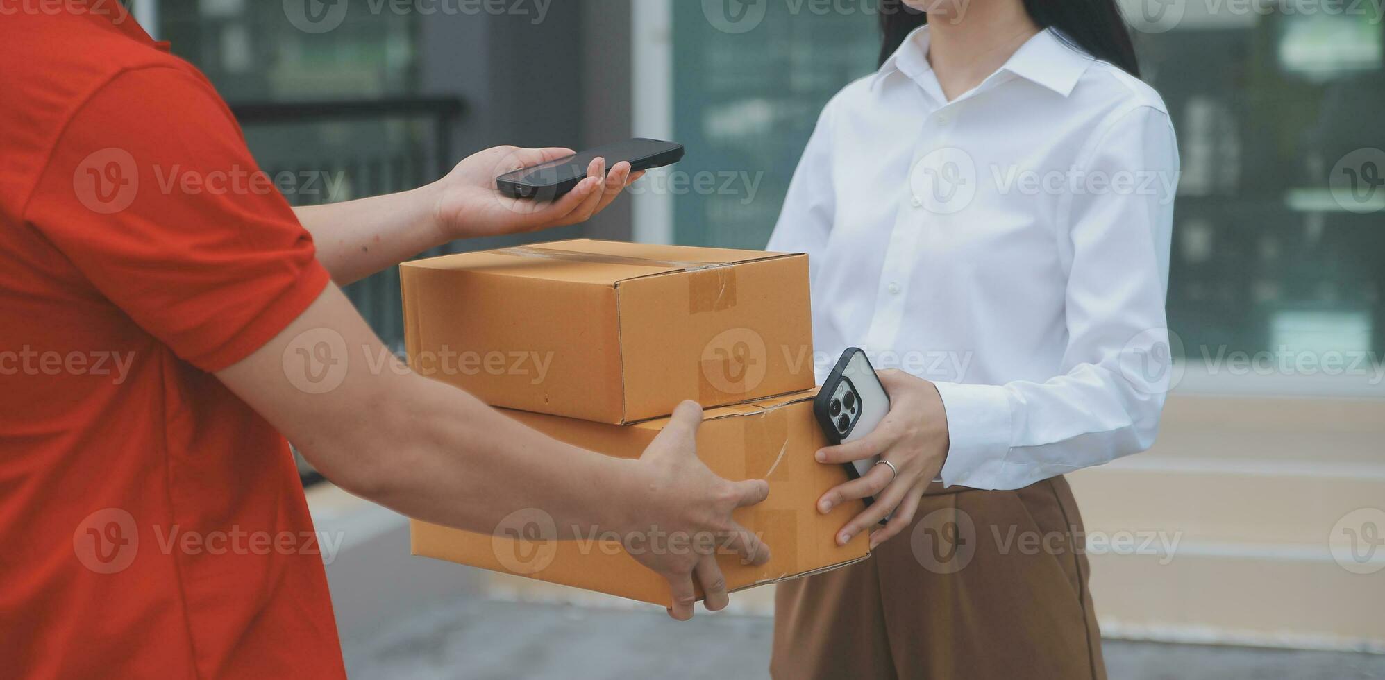 Asian Woman Receiving Product from delivery man at Home, Young Owner Woman Order Product from Smartphone Application, Woman with Online Business or SME Concept. photo