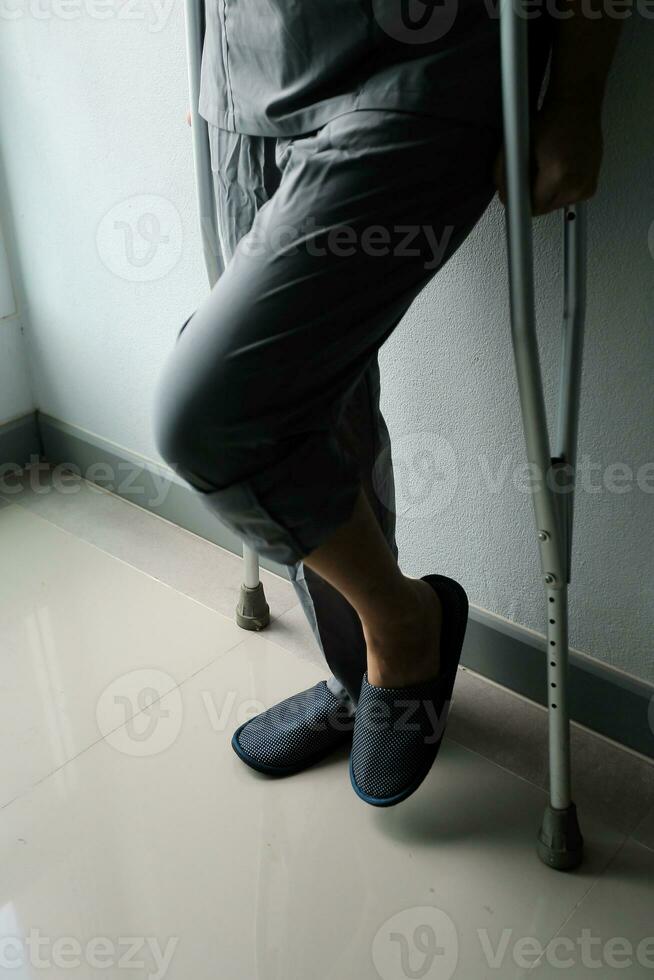 Physiotherapist is doing physical therapy for a patient, the patient has body aches due to overwork and has undergone treatment and physiotherapy with a professional physiotherapist. photo